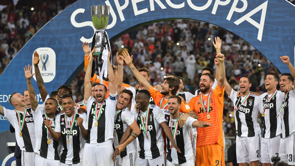 Juventus' Italian defender Giorgio Chiellini lifts the Supercoppa Italiana after winning the final between Juventus and AC Milan at the King Abdullah Sports City Stadium in Jeddah on January 16, 2019.